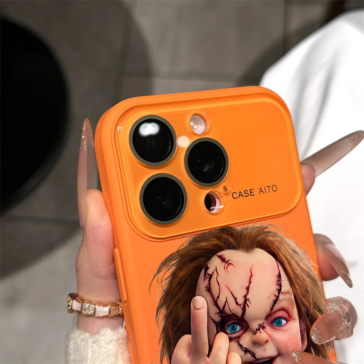 Chucky Creepy Gesture Pattern Dopamine Ins Style Solid Color Phone Case with Ultra Skin Friendly Touch, All Inclusive Lens Phone Case Suitable for Iphone 17 16 15 14 13 12 Pro Max Air