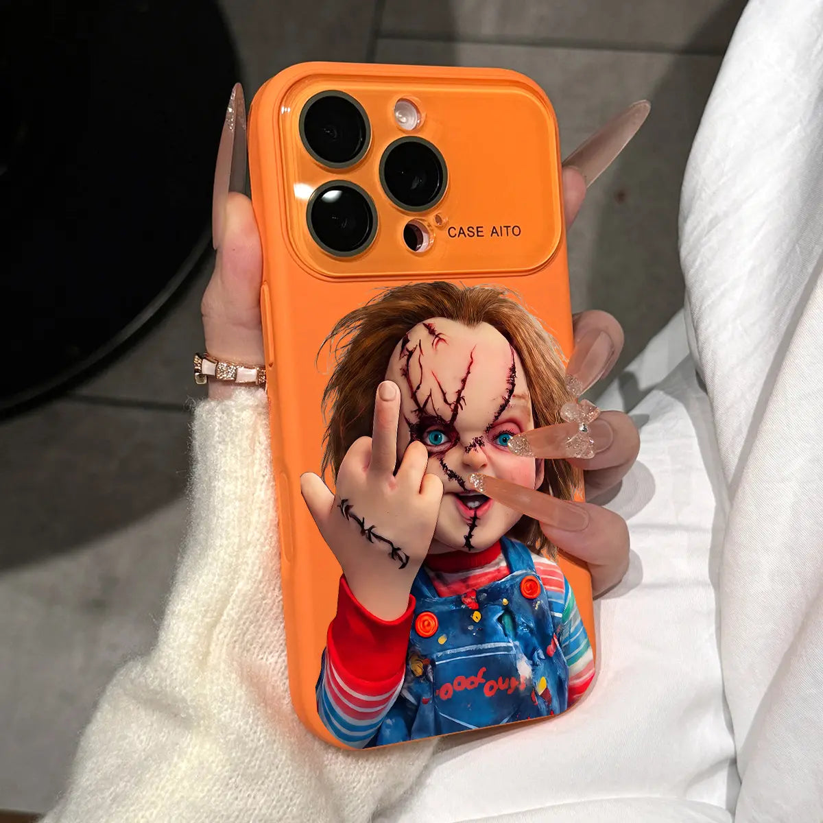 Chucky Creepy Gesture Pattern Dopamine Ins Style Solid Color Phone Case with Ultra Skin Friendly Touch, All Inclusive Lens Phone Case Suitable for Iphone 17 16 15 14 13 12 Pro Max Air